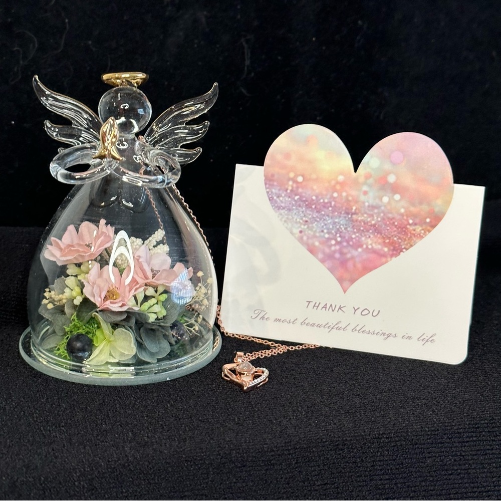Angel, clear with flowers inside, heart necklace. NWT